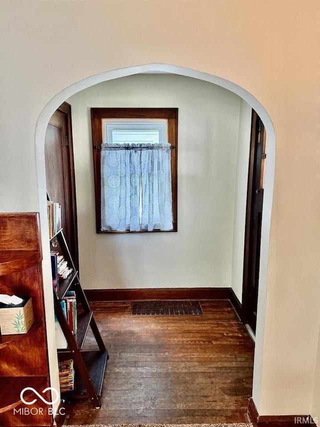 313 S Brittain Ave, Muncie, IN 47303 - corridor with arched walkways and wood finished floors