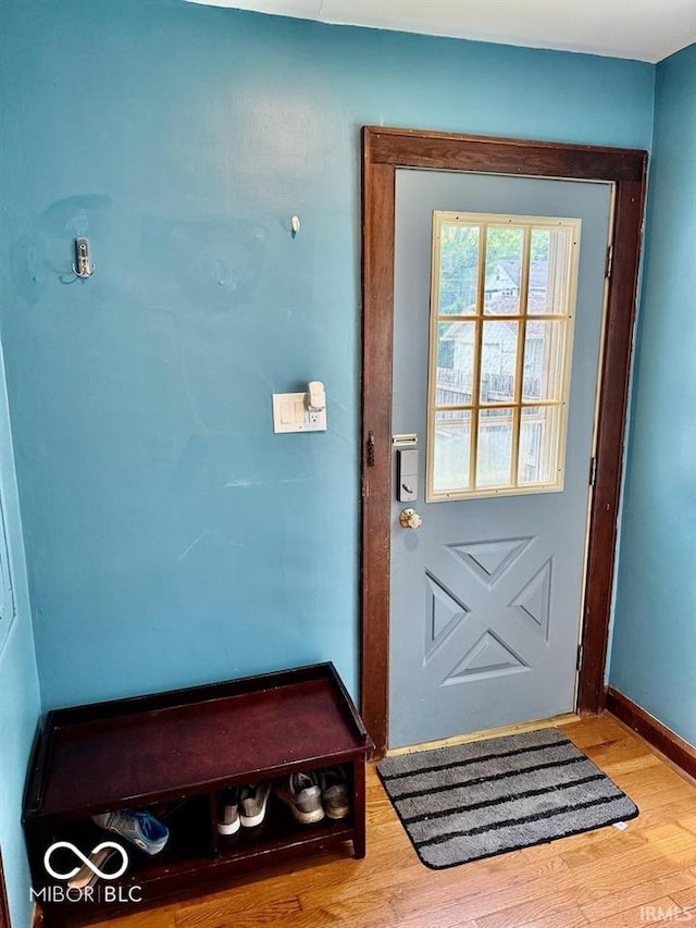 313 S Brittain Ave, Muncie, IN 47303 - doorway with wood finished floors and baseboards