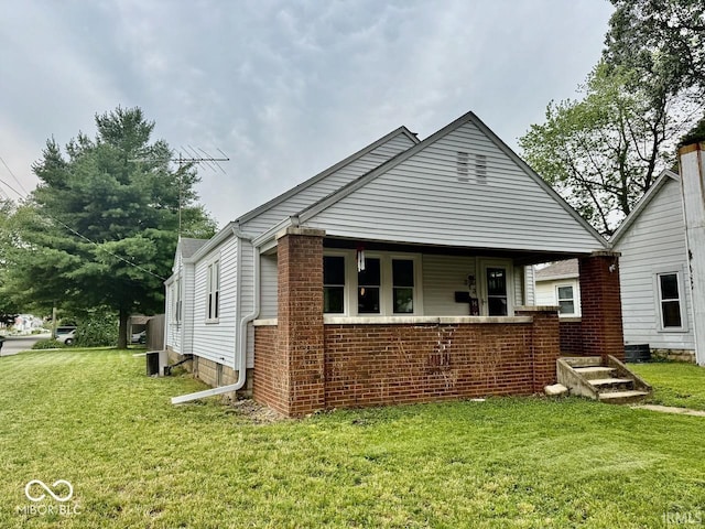 313 S Brittain Ave, Muncie, IN 47303 - view of front of house with a front lawn and brick siding