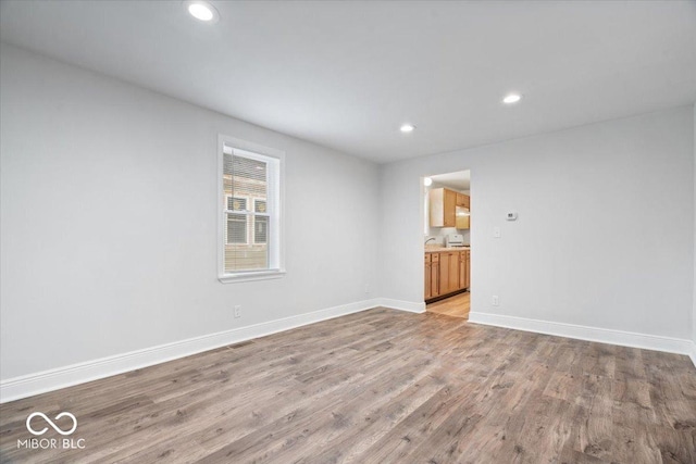 4310 Crittenden Ave, Indianapolis, IN 46205 - empty room featuring light wood finished floors and recessed lighting