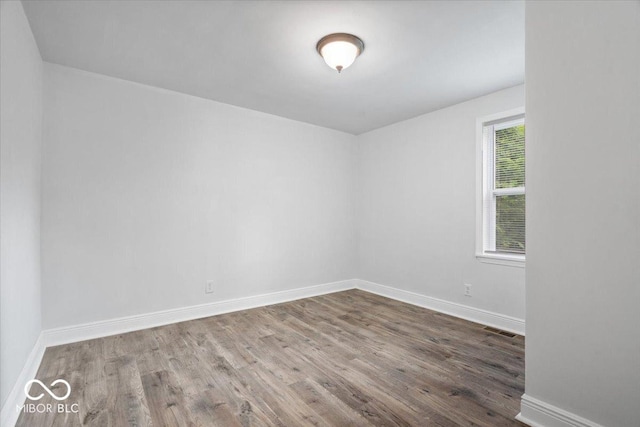 4310 Crittenden Ave, Indianapolis, IN 46205 - empty room with wood finished floors and baseboards