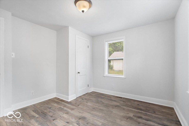 4310 Crittenden Ave, Indianapolis, IN 46205 - spare room featuring wood finished floors and baseboards