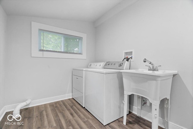 4310 Crittenden Ave, Indianapolis, IN 46205 - laundry room with washing machine and clothes dryer and wood finished floors