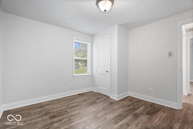 4310 Crittenden Ave, Indianapolis, IN 46205 - unfurnished bedroom featuring wood finished floors and baseboards