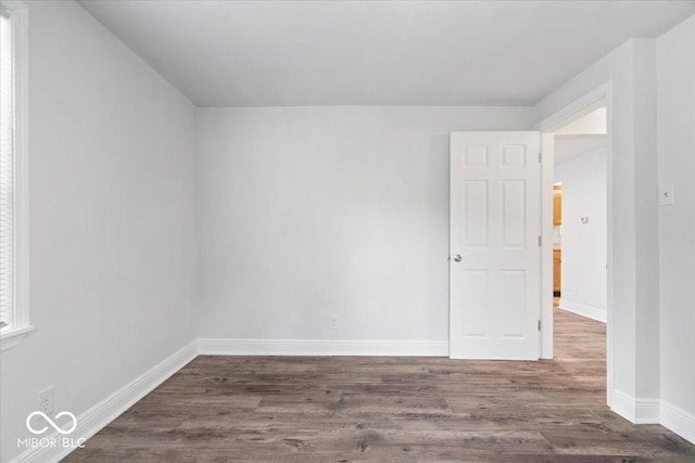 4310 Crittenden Ave, Indianapolis, IN 46205 - empty room featuring dark wood-type flooring and baseboards