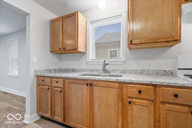4310 Crittenden Ave, Indianapolis, IN 46205 - kitchen with a sink and light stone countertops