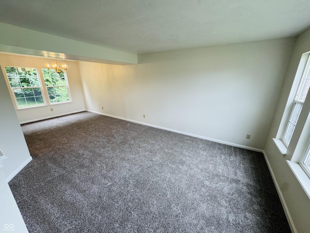 5938 Tybalt Ln, Indianapolis, IN 46254 - carpeted spare room with a chandelier and baseboards