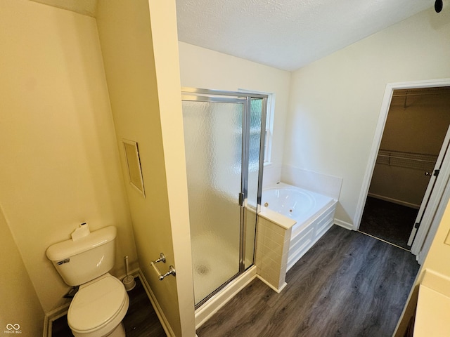 5938 Tybalt Ln, Indianapolis, IN 46254 - full bathroom featuring a shower stall, wood finished floors, a tub with jets, and a walk in closet