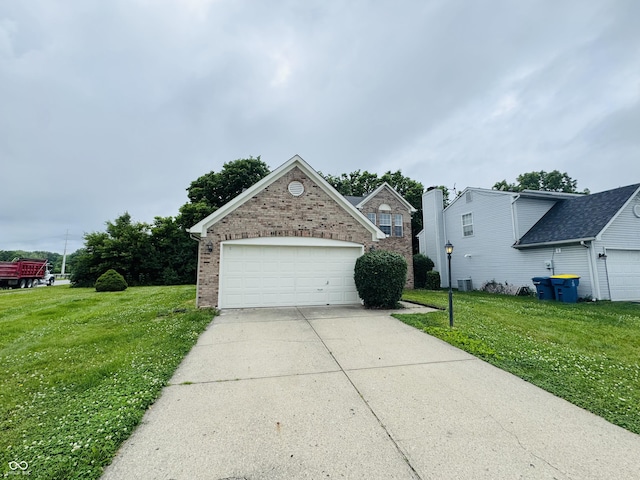 5938 Tybalt Ln, Indianapolis, IN 46254 - view of front of home with brick siding, a front lawn, and concrete driveway