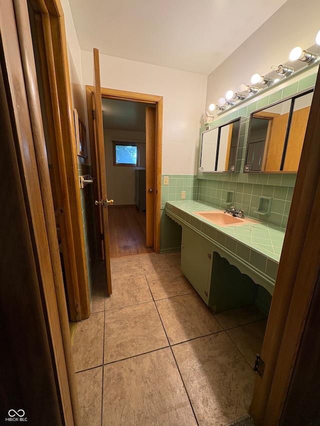 4609 Andover Rd, Indianapolis, IN 46226 - bathroom with vanity, tile patterned flooring, and tasteful backsplash