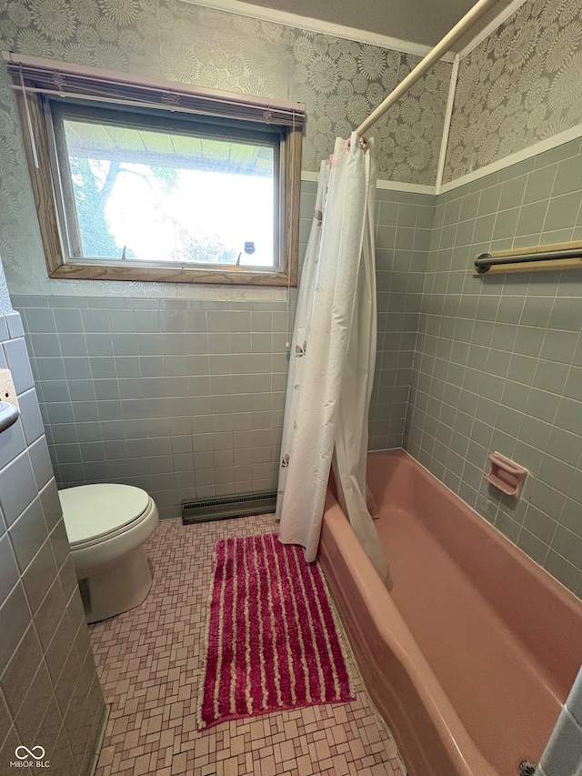 4609 Andover Rd, Indianapolis, IN 46226 - full bath featuring wallpapered walls, healthy amount of natural light, a wainscoted wall, shower / bath combo, and tile walls
