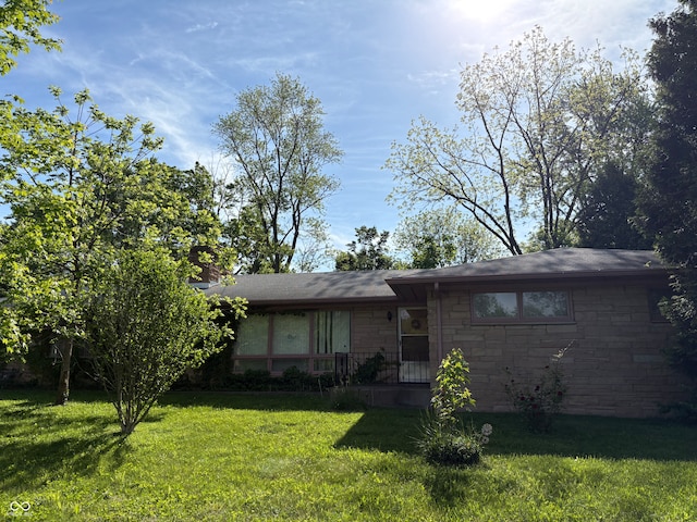 4609 Andover Rd, Indianapolis, IN 46226 - view of front of property featuring a front yard and stone siding