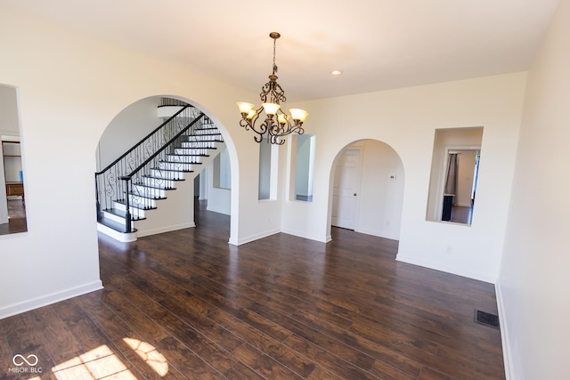 7493 W Lane Rd, Mccordsville, IN 46055 - unfurnished room with arched walkways, hardwood / wood-style floors, a chandelier, stairs, and recessed lighting