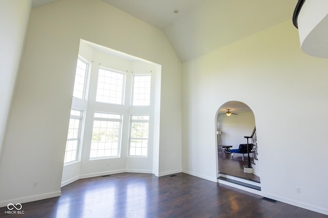 7493 W Lane Rd, Mccordsville, IN 46055 - unfurnished room featuring wood finished floors, high vaulted ceiling, a ceiling fan, and arched walkways