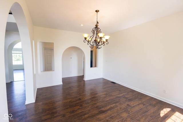 7493 W Lane Rd, Mccordsville, IN 46055 - spare room featuring dark wood-style flooring, a chandelier, arched walkways, and recessed lighting