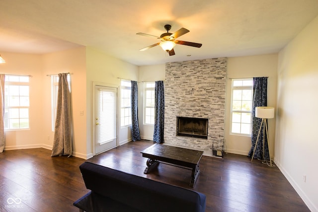 7493 W Lane Rd, Mccordsville, IN 46055 - living room with ceiling fan, dark wood-style flooring, and a stone fireplace