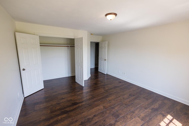 7493 W Lane Rd, Mccordsville, IN 46055 - unfurnished bedroom with dark wood-style flooring and a closet
