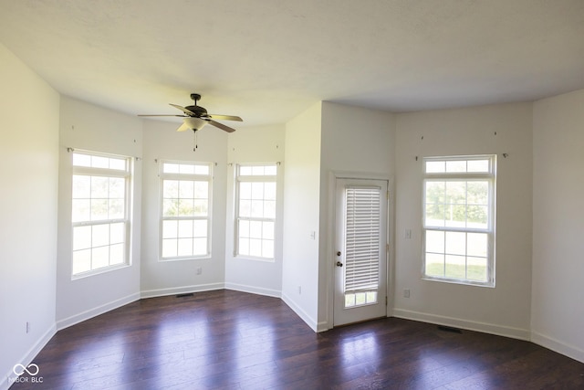 7493 W Lane Rd, Mccordsville, IN 46055 - empty room with healthy amount of natural light, ceiling fan, and hardwood / wood-style flooring