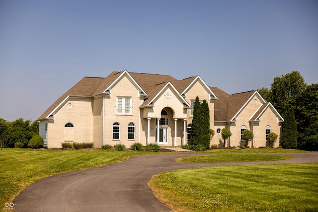 7493 W Lane Rd, Mccordsville, IN 46055 - view of front of property featuring a front lawn and curved driveway