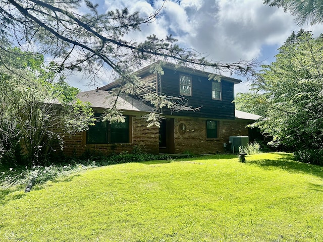 8875 N Goat Hollow Rd, Mooresville, IN 46158 - rear view of property featuring brick siding and a lawn