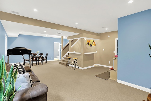 6050 Acorn Dr, Columbus, IN 47201 - carpeted living area with stairway and recessed lighting