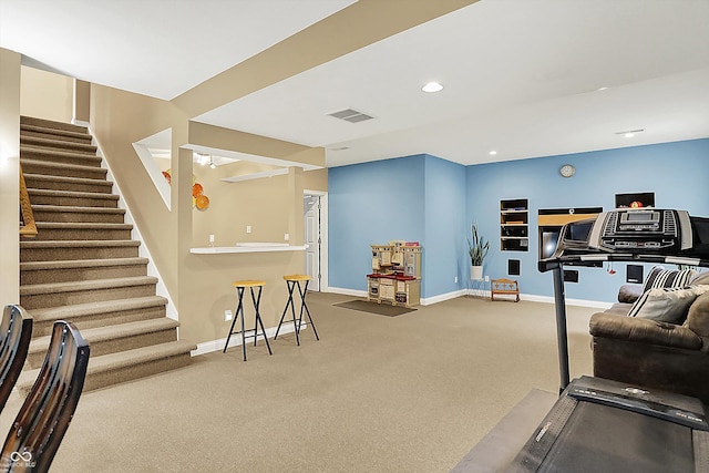 6050 Acorn Dr, Columbus, IN 47201 - living room with stairs, carpet, and recessed lighting