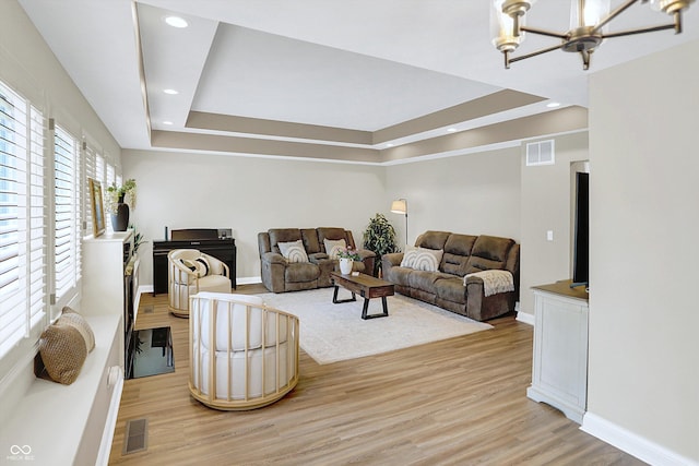6050 Acorn Dr, Columbus, IN 47201 - living area with a chandelier, a raised ceiling, light wood finished floors, and recessed lighting