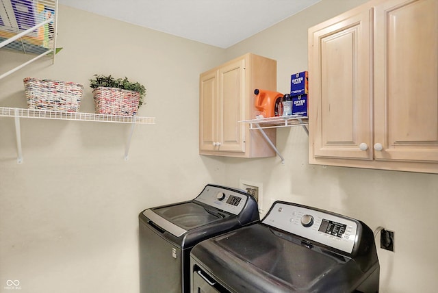 6050 Acorn Dr, Columbus, IN 47201 - washroom with cabinet space and independent washer and dryer
