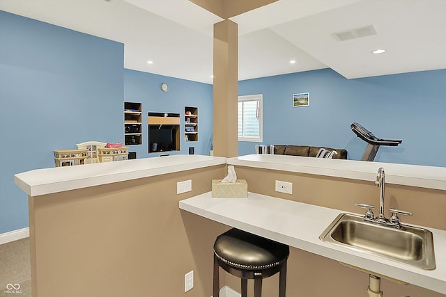 6050 Acorn Dr, Columbus, IN 47201 - kitchen with open floor plan, light countertops, a kitchen breakfast bar, and recessed lighting
