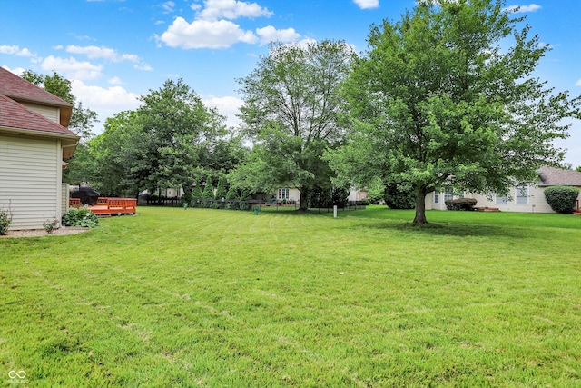 6050 Acorn Dr, Columbus, IN 47201 - view of green lawn featuring a wooden deck