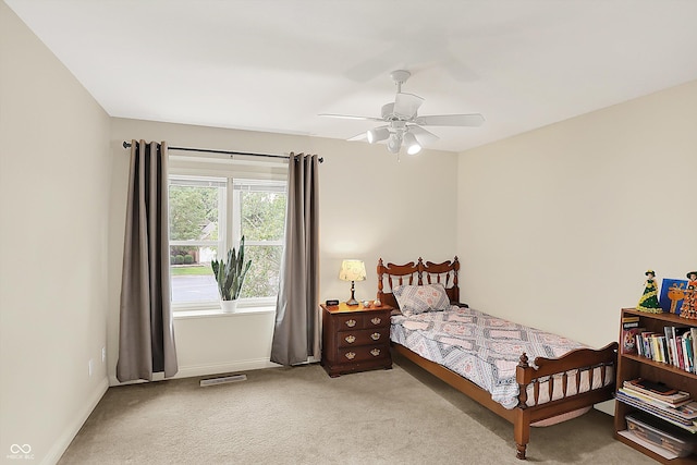 6050 Acorn Dr, Columbus, IN 47201 - carpeted bedroom featuring baseboards and a ceiling fan