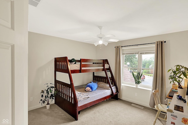 6050 Acorn Dr, Columbus, IN 47201 - carpeted bedroom featuring baseboards and ceiling fan