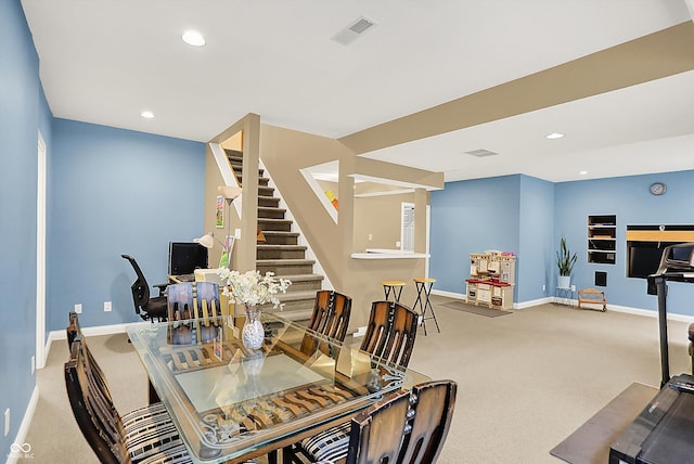 6050 Acorn Dr, Columbus, IN 47201 - dining area featuring carpet, stairs, and recessed lighting