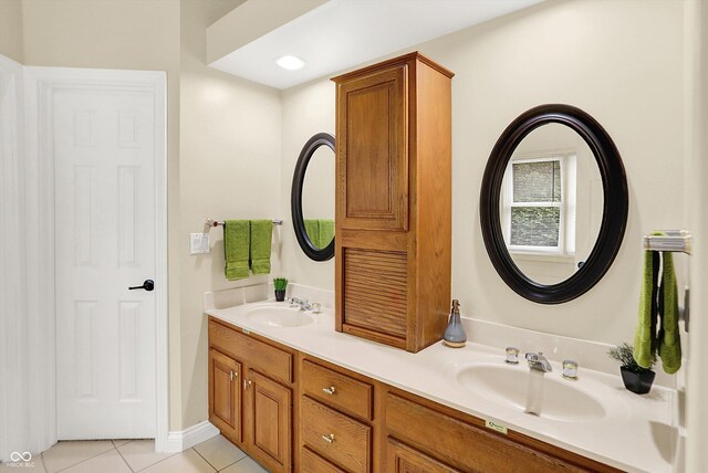 6050 Acorn Dr, Columbus, IN 47201 - bathroom with tile patterned flooring and double vanity