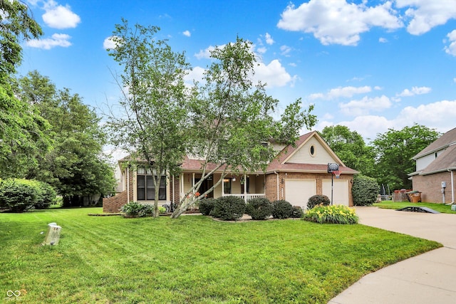 6050 Acorn Dr, Columbus, IN 47201 - view of front of house with brick siding, driveway, a porch, a front lawn, and a garage