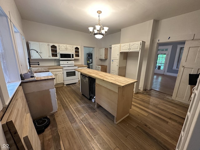 6100 Hodgin Rd, Richmond, IN 47374 - kitchen with white appliances, wooden counters, a chandelier, and dark wood-style flooring