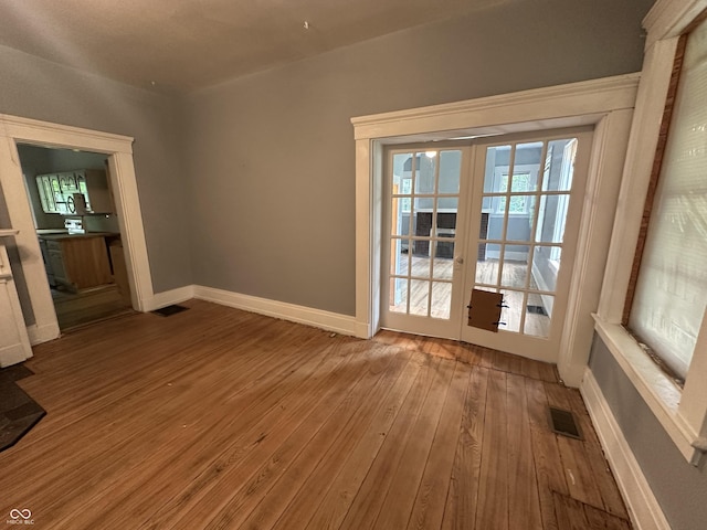 6100 Hodgin Rd, Richmond, IN 47374 - spare room with french doors and wood-type flooring