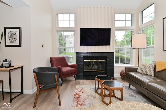 9477 Aberdare Dr N, Indianapolis, IN 46250 - living room featuring a fireplace and wood finished floors