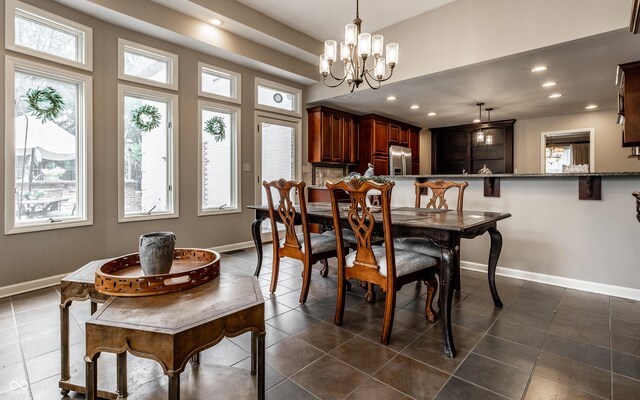 7743 Camelback Dr, Indianapolis, IN 46250 - dining area with plenty of natural light, recessed lighting, a chandelier, and dark tile patterned floors