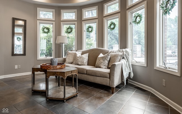 7743 Camelback Dr, Indianapolis, IN 46250 - living room with healthy amount of natural light and dark tile patterned floors