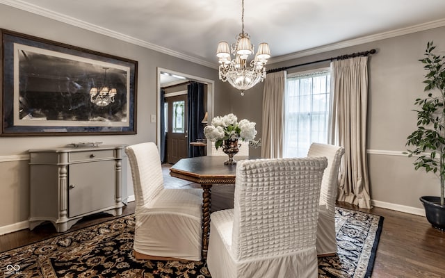 7743 Camelback Dr, Indianapolis, IN 46250 - dining space featuring healthy amount of natural light, wood finished floors, a chandelier, and ornamental molding