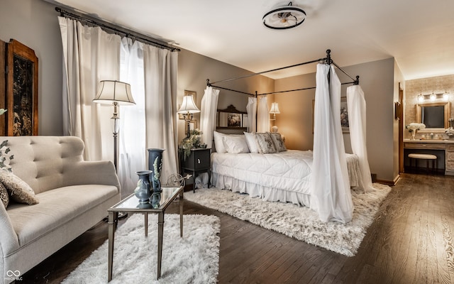 7743 Camelback Dr, Indianapolis, IN 46250 - bedroom featuring wood finished floors and connected bathroom