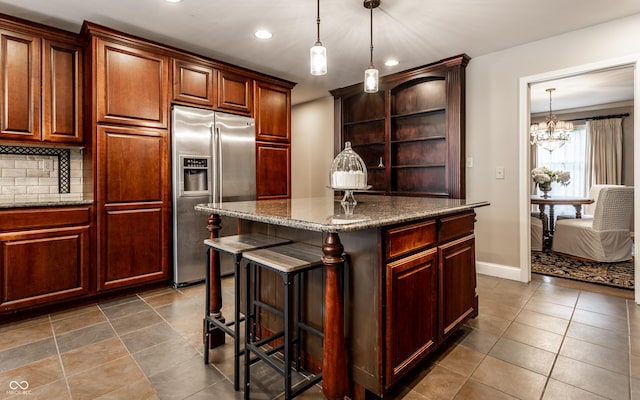 7743 Camelback Dr, Indianapolis, IN 46250 - kitchen featuring stainless steel fridge, open shelves, recessed lighting, a chandelier, and a center island
