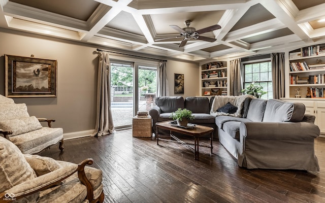 7743 Camelback Dr, Indianapolis, IN 46250 - living area with dark wood-style flooring, plenty of natural light, a ceiling fan, ornamental molding, and beamed ceiling