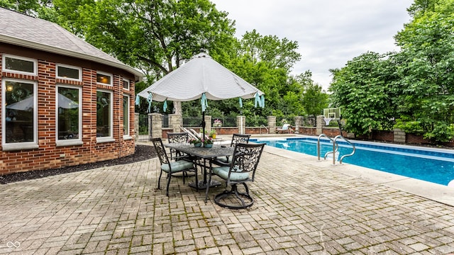 7743 Camelback Dr, Indianapolis, IN 46250 - view of swimming pool with a patio, a fenced backyard, and outdoor dining area