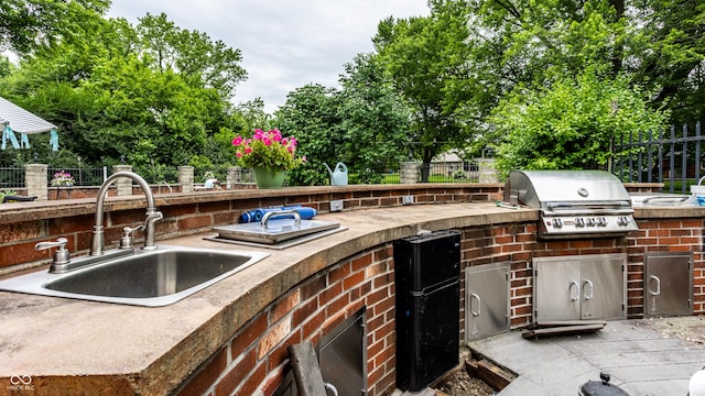 7743 Camelback Dr, Indianapolis, IN 46250 - view of patio with a sink and an outdoor kitchen