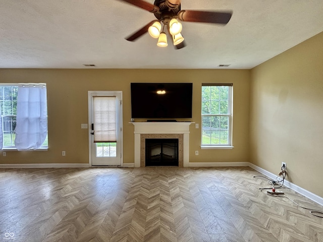 5571 Auburndale Dr, Bargersville, IN 46106 - unfurnished living room featuring a fireplace, ceiling fan, and a textured ceiling
