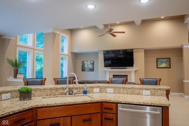 23119 Sonoma Ln, Cicero, IN 46034 - kitchen featuring dishwasher, a towering ceiling, a ceiling fan, open floor plan, and light stone counters