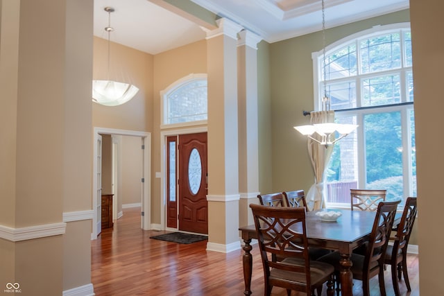 23119 Sonoma Ln, Cicero, IN 46034 - foyer entrance featuring a towering ceiling, wood finished floors, a chandelier, ornamental molding, and ornate columns