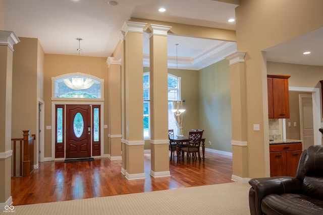 23119 Sonoma Ln, Cicero, IN 46034 - entrance foyer featuring decorative columns, wood finished floors, a towering ceiling, ornamental molding, and recessed lighting